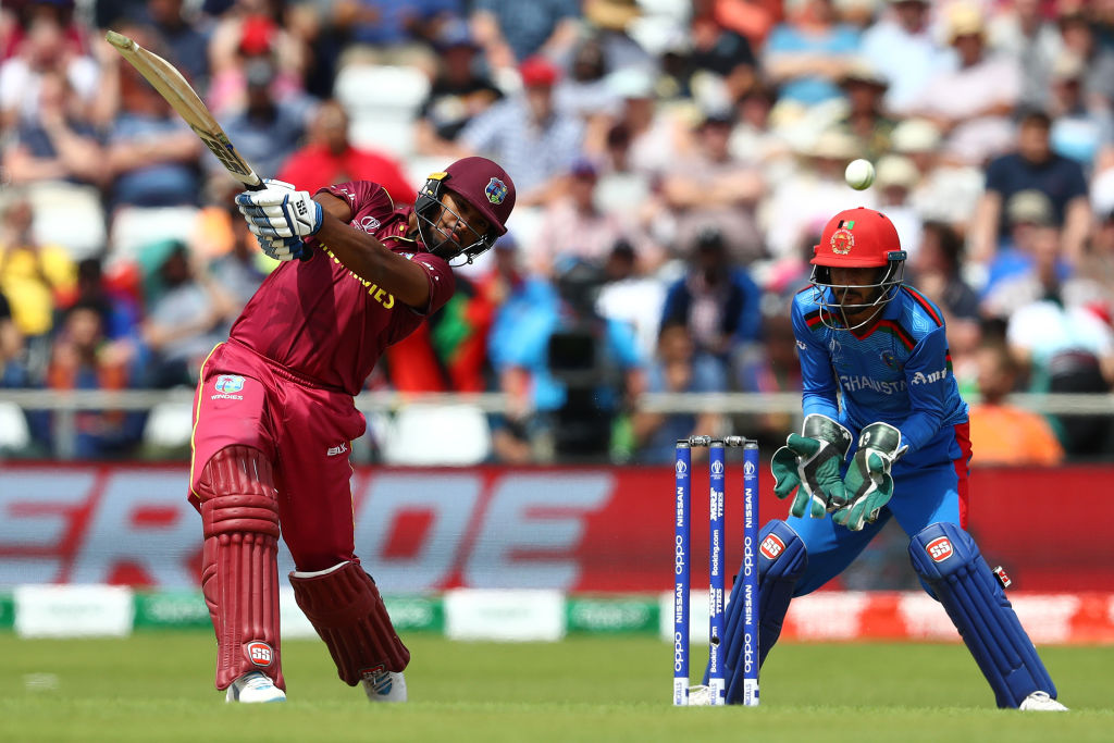 Nicholas Pooran hits a lofted shot for West Indies against Afghanistan in the World Cup