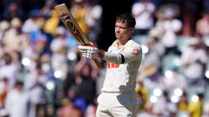 Australia’s Alex Carey celebrates reaching his century on day one of the third Ashes Test in Adelaide
