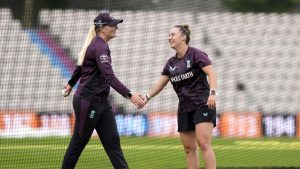 Alice Capsey (right) shares a laugh with fellow spinner Sophie Ecclestone during an England nets session