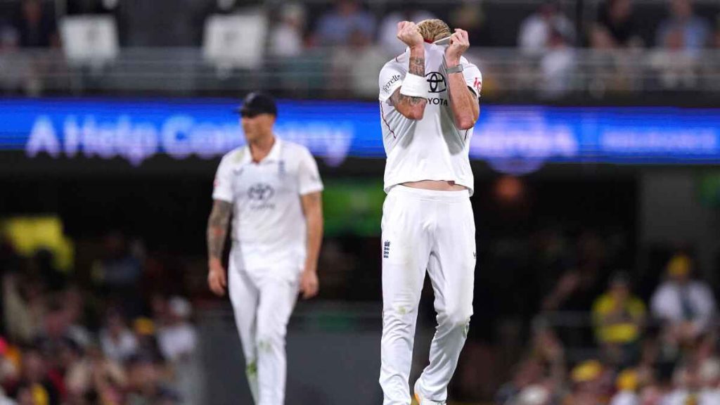England’s Ben Stokes pulls his shirt over his face in frustration as Australia bat in Brisbane