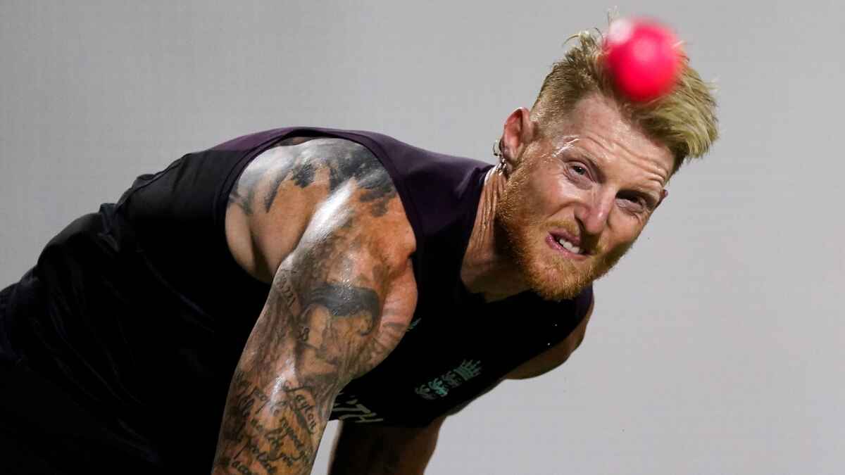 Ben Stokes grimaces while bowling in the nets