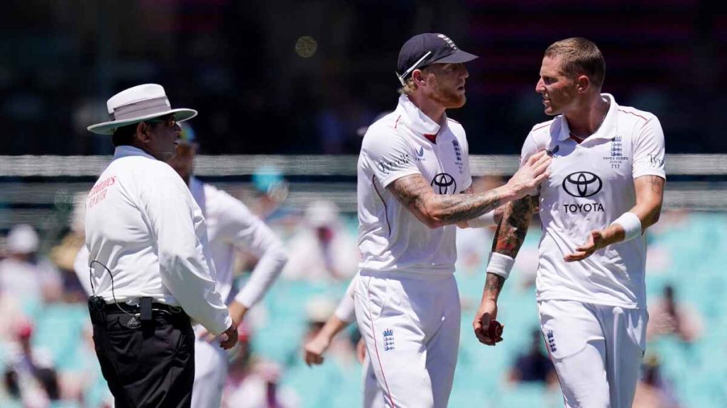 England’s Ben Stokes (centre) has to push Brydon Carse away from the umpire after an unsuccessful review