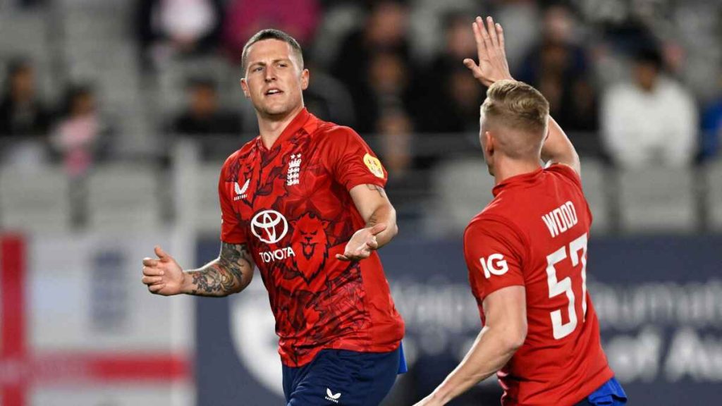 Brydon Carse, left, celebrates taking the wicket of Tim Robinson