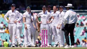 England players look dejected and confused after an unsuccessful review for caught behind