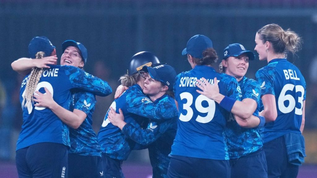 England's players celebrate victory over India