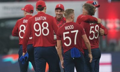 England players celebrate after winning against Nepal