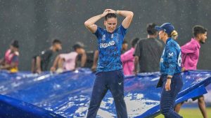 England’s Em Arlott leaves the field as it rains during the ICC Women’s Cricket World Cup match between England and Pakistan at the R Premadasa Stadium in Colombo