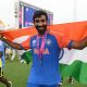 Jasprit Bumrah smiles during a lap of honour after India won the 2024 ICC Men's T20 Cricket World Cup (Philip Brown/Getty Images)