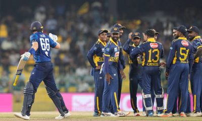 Joe Root exchanges words with the Sri Lanka team after his dismissal