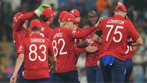 Jofra Archer celebrates with England team-mates after the early wicket of Shai Hope