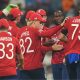 Jofra Archer celebrates with England team-mates after the early wicket of Shai Hope