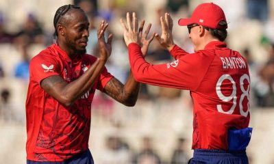 Jofra Archer, left, celebrates taking a wicket