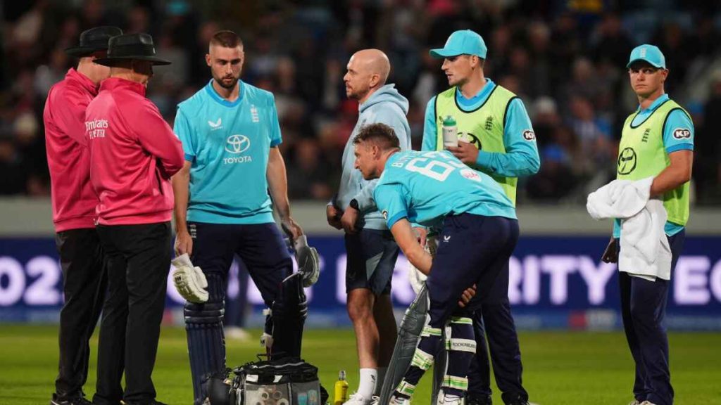 England’s Jos Buttler receives treatment for an injury