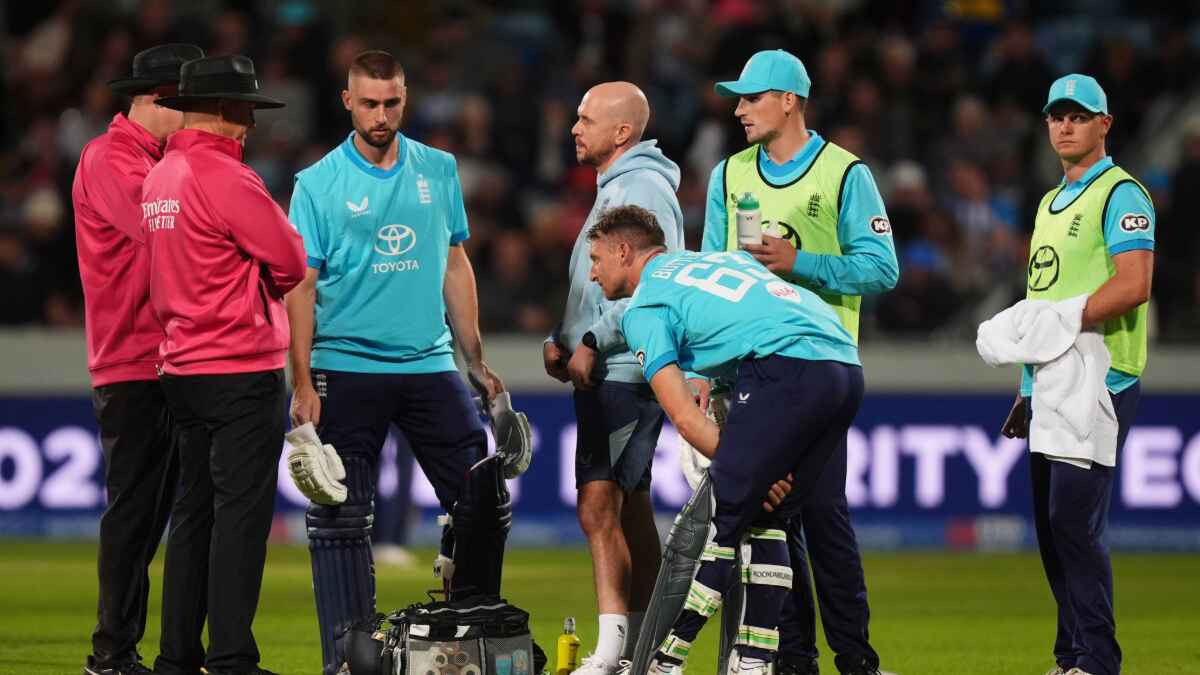 England’s Jos Buttler receives treatment for an injury
