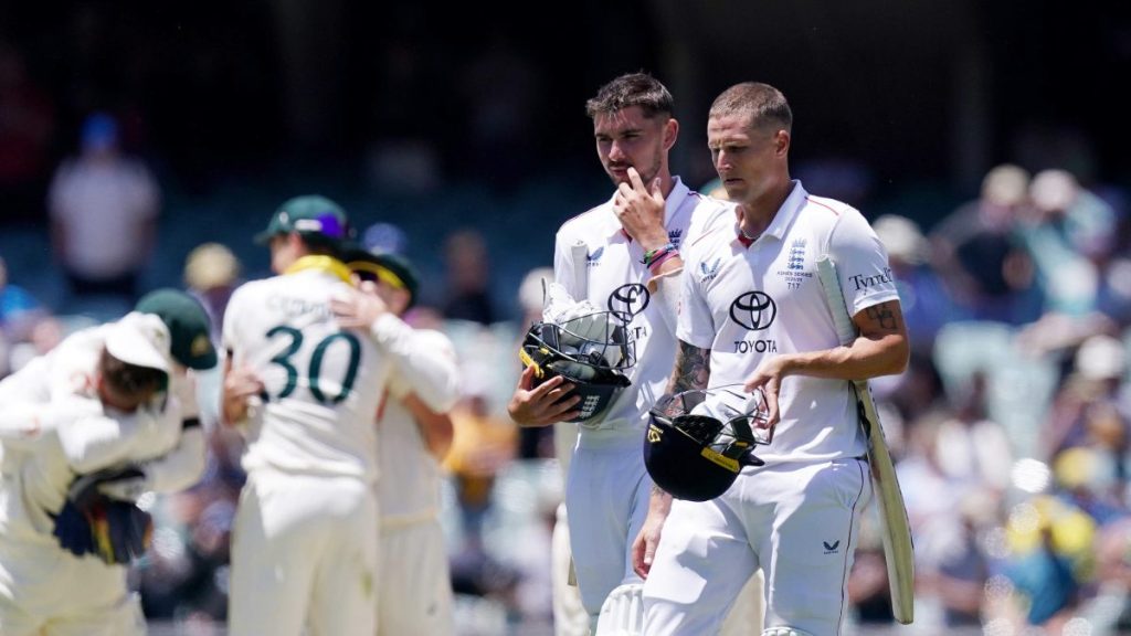 England’s Josh Tongue (left) and Brydon Carse (right) walk off the field after defeat on day five of the third Ashes Test in Adelaide
