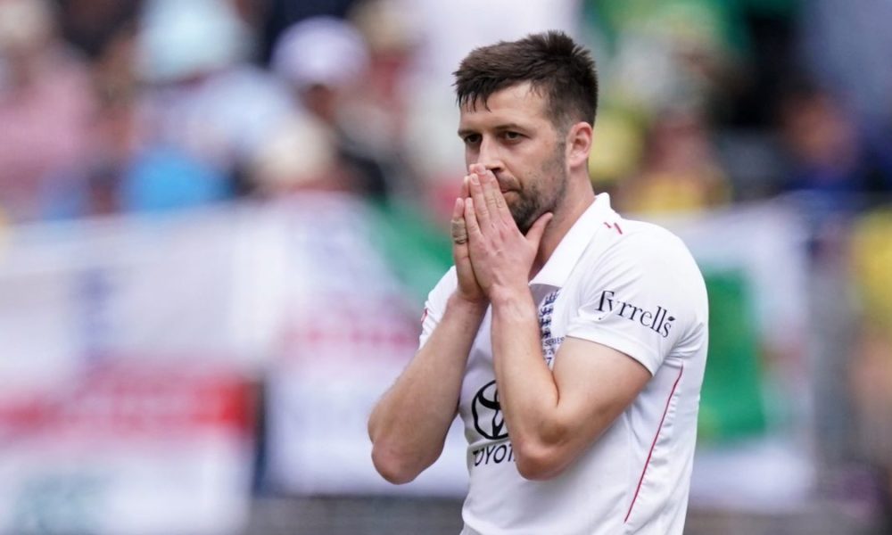 England's Mark Wood looks frustrated after being hit for a six