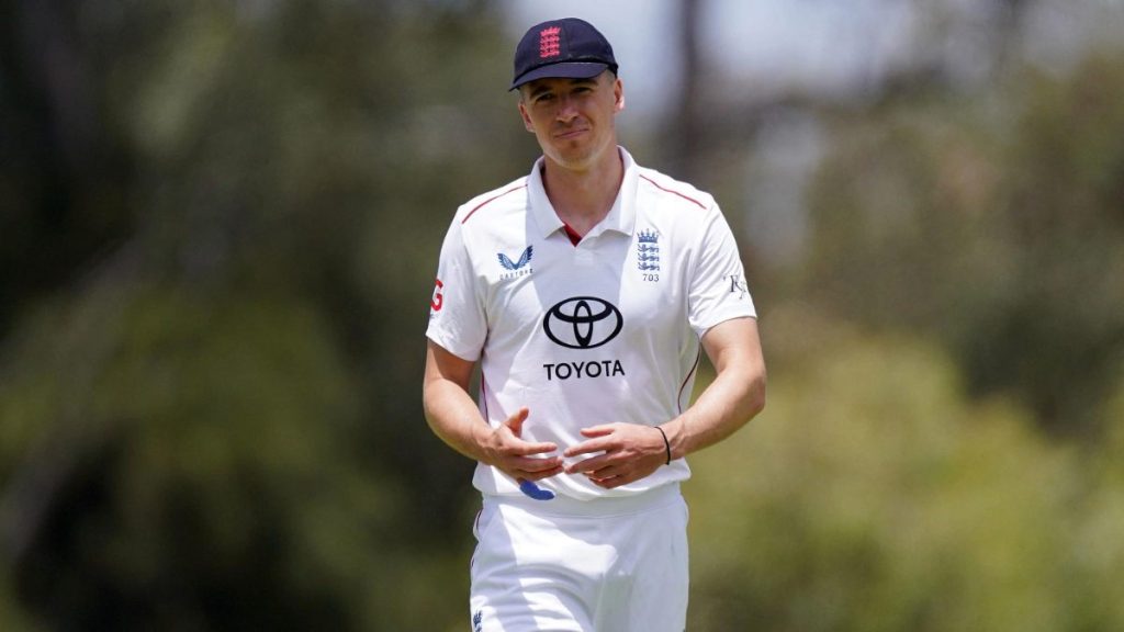 England Lions’ Matt Fisher stands in the field