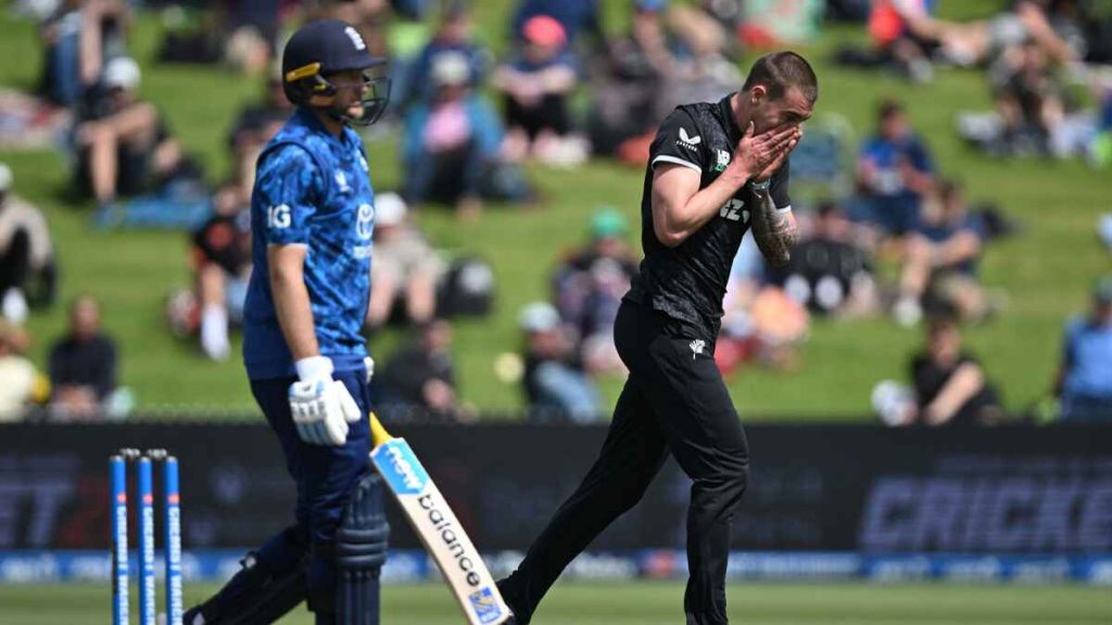 New Zealand bowler Blair Tickner, right, reacts after taking the wicket of England’s Joe Root