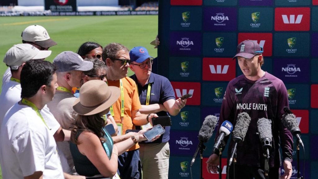 Ollie Pope fields questions at a press conference in Brisbane.
