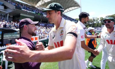 Australia’s Pat Cummins shakes hands with England head coach Brendon McCullum