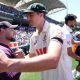Australia’s Pat Cummins shakes hands with England head coach Brendon McCullum