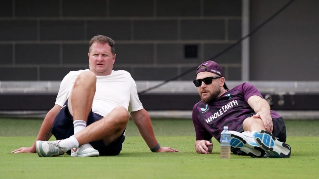 Rob Key sits with Brendon McCullum