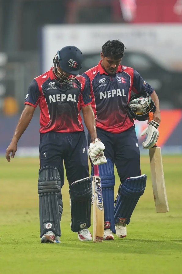 Nepal&rsquo;s Lokesh Bam and Karan KC walk back to the pavilion after their defeat to England