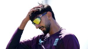 England’s Shoaib Bashir puts his hand to his head in training.