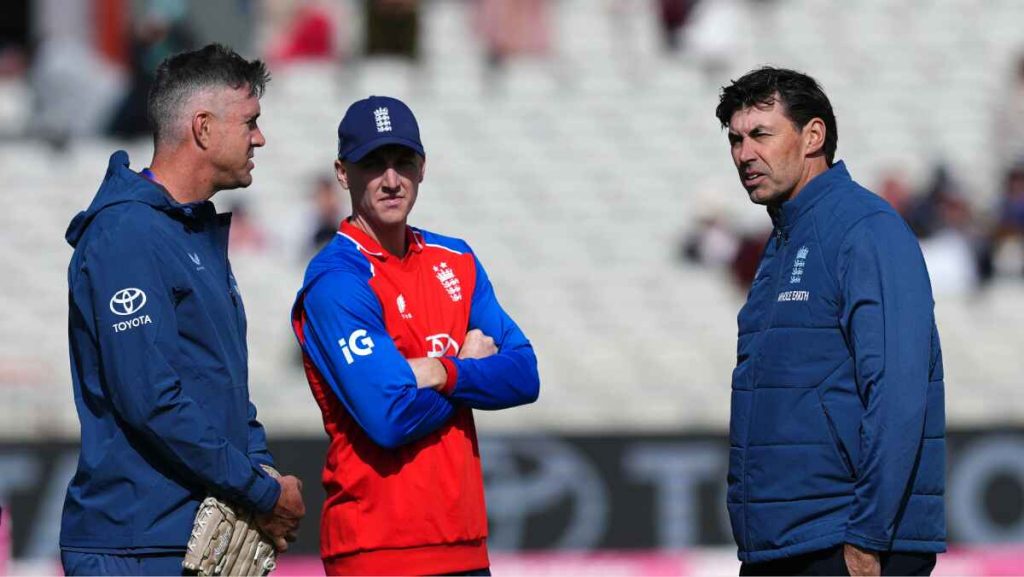 New England Test head coach Stephen Fleming, right, has put the miles in.