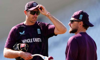 Tim Southee, left, chats to Brendon McCullum, right