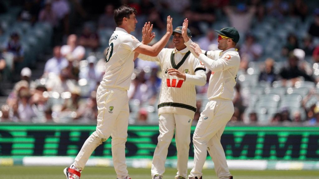Australian players celebrate their Ashes win in Adelaide.