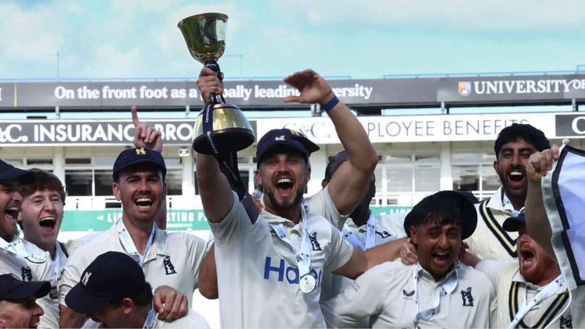 Warwickshire’s captain Ed Barnard lifts the County Championship trophy