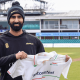 Yadvinder Singh poses with his Leicestershire shirt after signing a short-term deal at Grace Road.