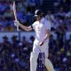 England’s Zak Crawley raises his bat to celebrate reaching his half century on day one of the second Ashes Test in Brisbane